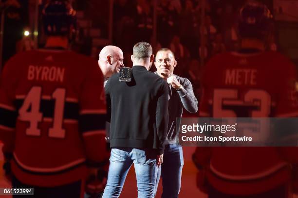 George St-Pierre facing UFC Michael Bisping at center ice prior to the Toronto Maple Leafs versus the Montreal Canadiens game on October 14 at Bell...