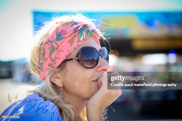 mature blond lady wearing a headband - paul mansfield photography stock pictures, royalty-free photos & images
