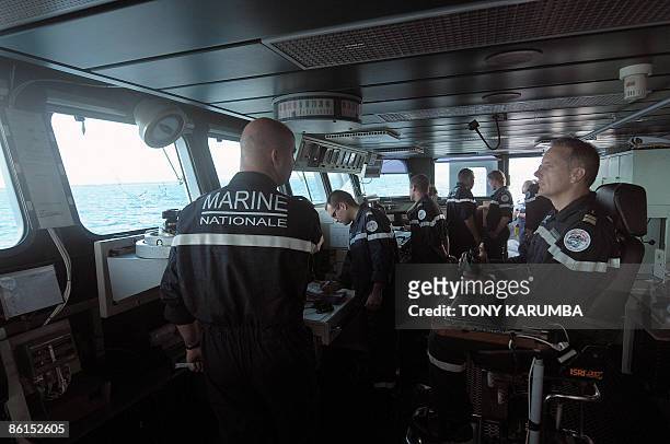 Capatain of the French frigate, 'Nivose', Jean-Marc le Quilliec sits in the control room of the ship which is carrying 11 suspected pirates and...