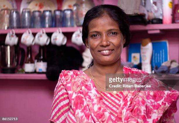 Munni, the foster Mother of Rubina Ali, of Slumdog Millionaire fame, stands inside her home at Garib Nagar, April 22, 2009 in the slums of Bandra,...