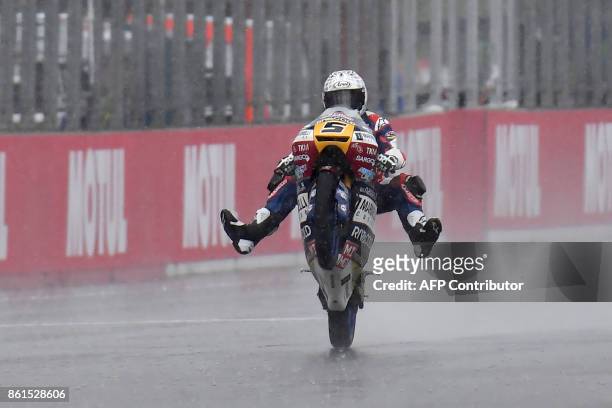 Honda rider Romano Fenati of Italy celebrates his victory in the Moto3 class of the MotoGP Japanese Grand Prix at Twin Ring Motegi circuit in Motegi,...