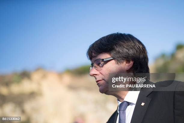 Catalan regional government president Carles Puigdemont leaves after a ceremony commemorating the 77th anniversary of the death of Catalan leader...