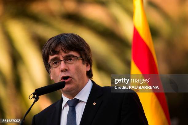 Catalan regional government president Carles Puigdemont delivers a speech on the sidelines of a wreath-laying ceremony commemorating the 77th...