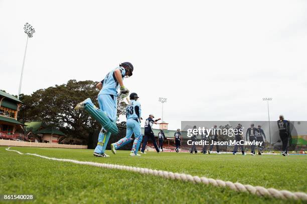 Players take to the field during the JLT One Day Cup match between New South Wales and Victoria at North Sydney Oval on October 15, 2017 in Sydney,...