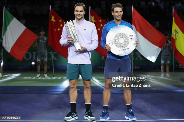 Roger Federer of Switzerland with Rafael Nadal of Spain pose with their trophy after the Men's singles final mach on day eight of 2017 ATP Shanghai...