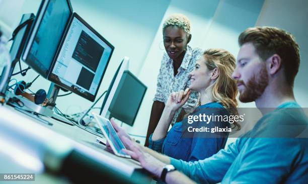 web designers at work. - african american web designers stock pictures, royalty-free photos & images