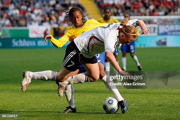 Melanie Behringer of Germany is challenged by Ester of Brazil during the Women's International Friendly match between Germany and Brazil at the...