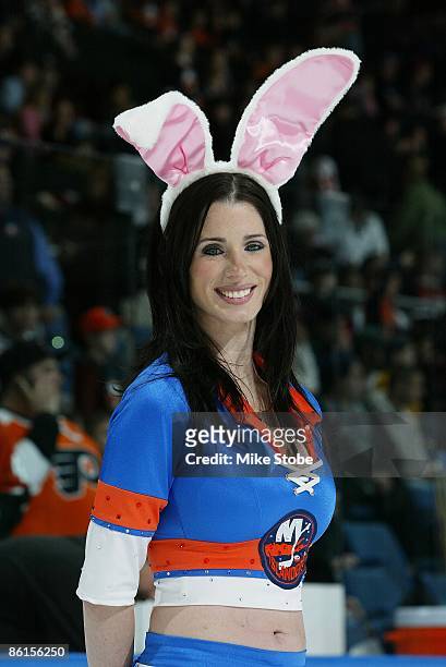 New York Islanders Ice Girl Kelli poses for a photo wearing Easter bunny ears during an intermission against the Philadelphia Flyers on April 11,...