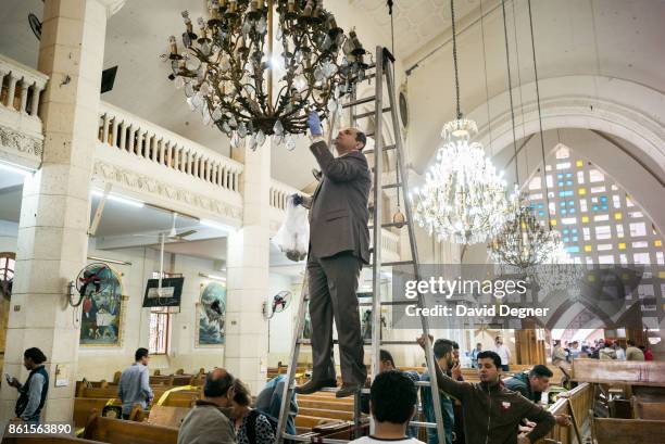 April 09: An inspector looks for evidence inside the Mar Girgis church where a bomb exploded during Palm Sunday Services on April 09, 2017 in Tanta,...