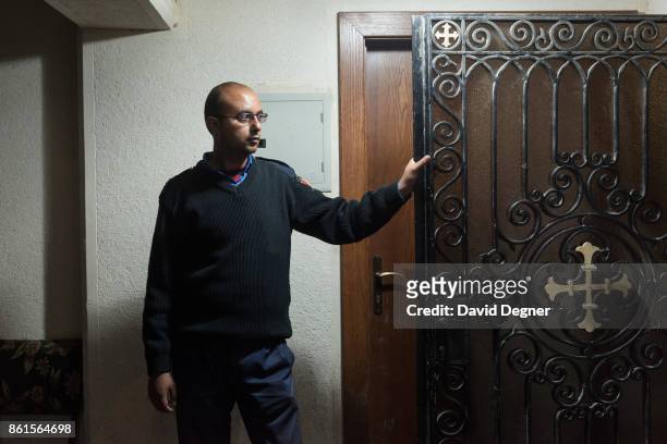 April 10: Albeir, a guard at the Mar Girgis church stands at the door during Holy Week on April 10, 2017 in Tanta, Egypt.