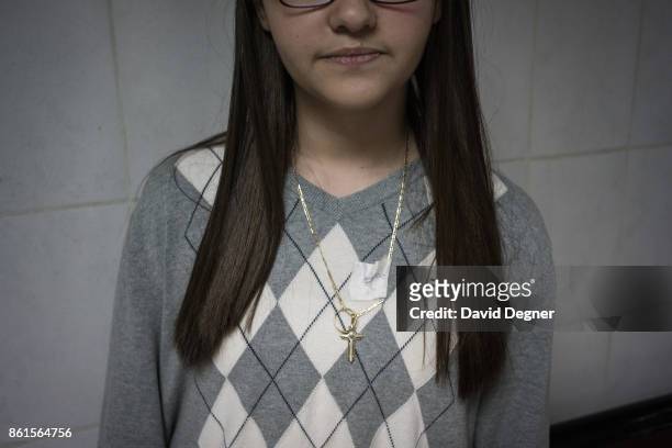 April 10: The daughter of Abdo who was killed in a bomb that exploded during Palm Sunday Services, she is wearing the sweater and recovered ring and...