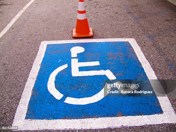 parking space with handicap symbol - handicap parking space stock pictures, royalty-free photos & images