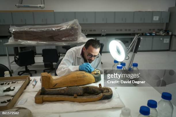 Cairo, Egypt In the back of the Grand Egyptian Museum workers are already restoring pieces that are stored there and moved from other locations on...