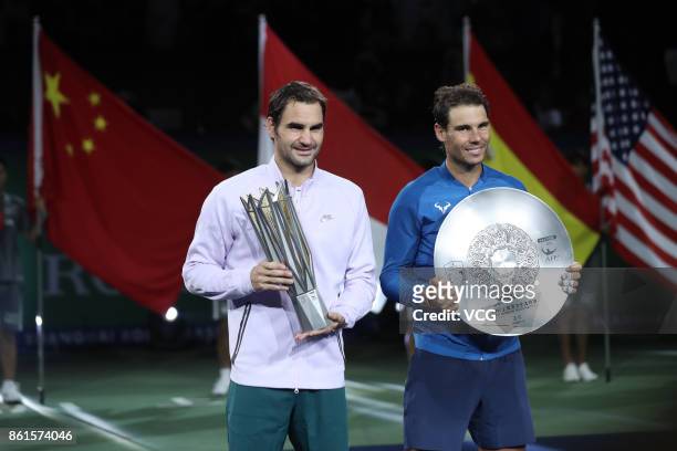 Roger Federer of Switzerland and Rafael Nadal of Spain pose with their trophies after the Men's singles final mach on day eight of 2017 ATP Shanghai...