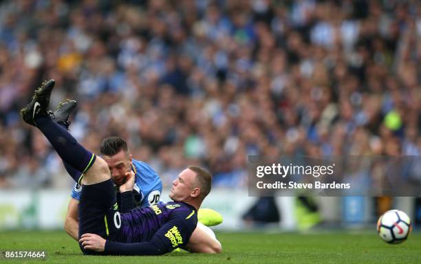 Wayne Rooney of Everton is tackled by Shane Duffy of Brighton and Hove Albion during the Premier League match between Brighton and Hove Albion and...