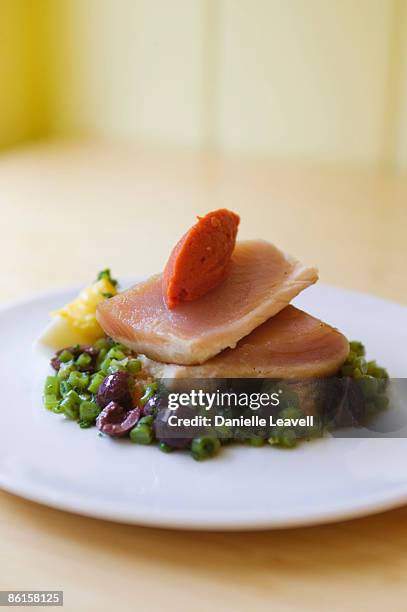 seared yellowtail with olive and herb salad - amberjack stock pictures, royalty-free photos & images