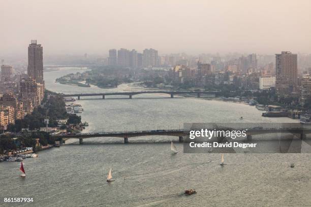 September 24: Felluca boats and a ferry sale on the Nile near the Cairo University Bridge on September 24, 2017 in Cairo, Egypt. Overview photos of...