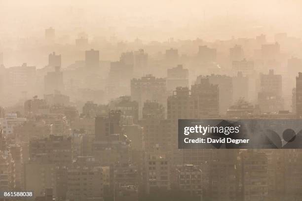 September 24: The skyline of buildings poking through pollution seen at sunset in Giza on September 24, 2017 in Cairo, Egypt. Overview photos of...