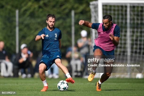 Miralem Pjanic and Medhi Benatia during a Juventus traininig session at Juventus Center Vinovo on October 15, 2017 in Vinovo, Italy.