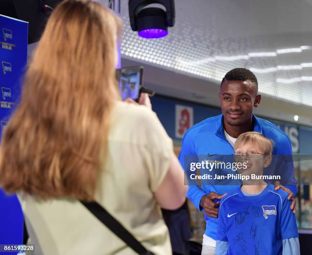 Salomon Kalou of Hertha BSC poses for a fan photo during the signing session in the Gropius Passagen on October 15, 2017 in Berlin, Germany.