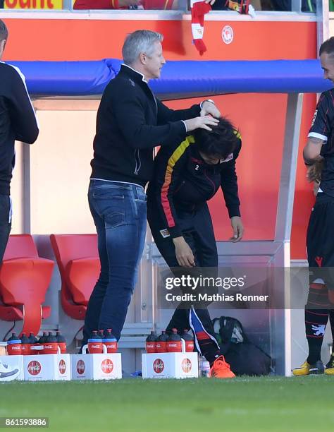 Coach Jens Keller and Atsuto Uchida of 1.FC Union Berlin after the game between Jahn Regensburg and Union Berlin on october 15, 2017 in Regensburg,...