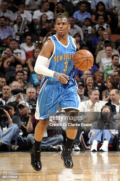 Chris Paul of the New Orleans Hornets makes a move to the basket during the game against the San Antonio Spurs at AT&T Center on April 15, 2009 in...