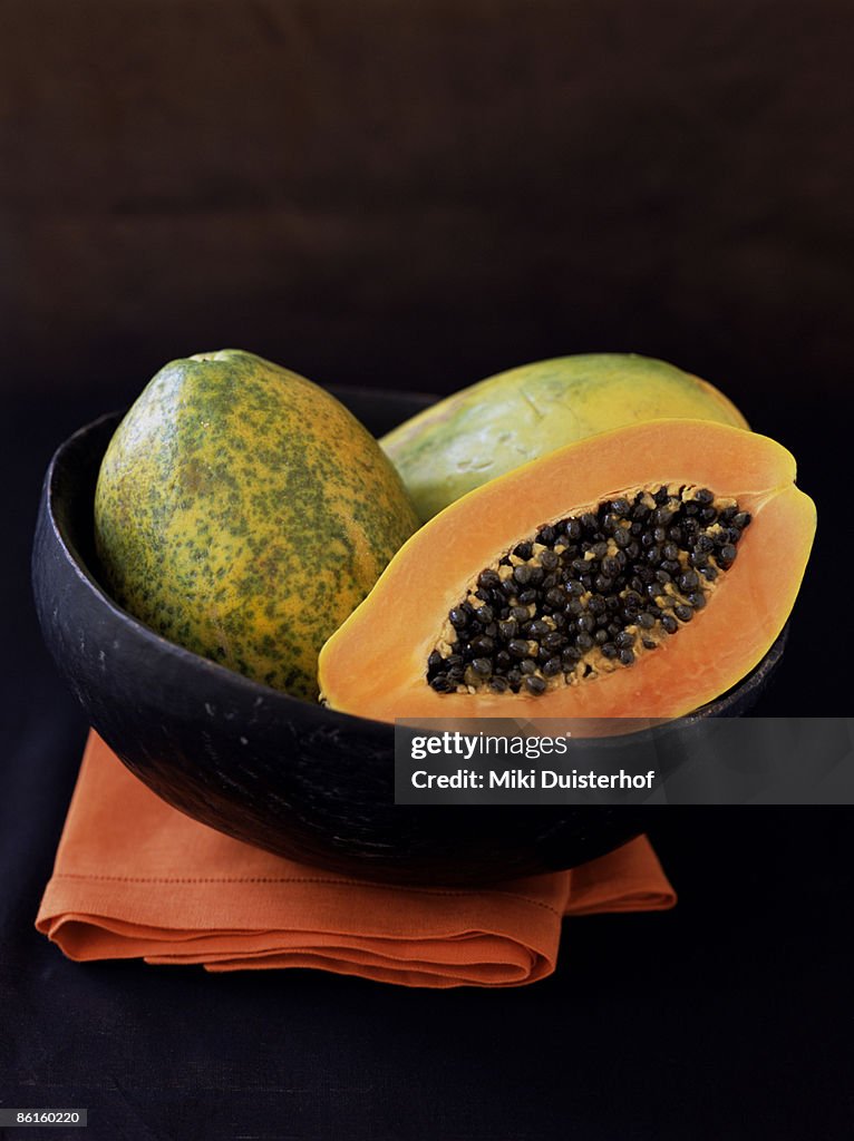 Papaya in wooden bowl