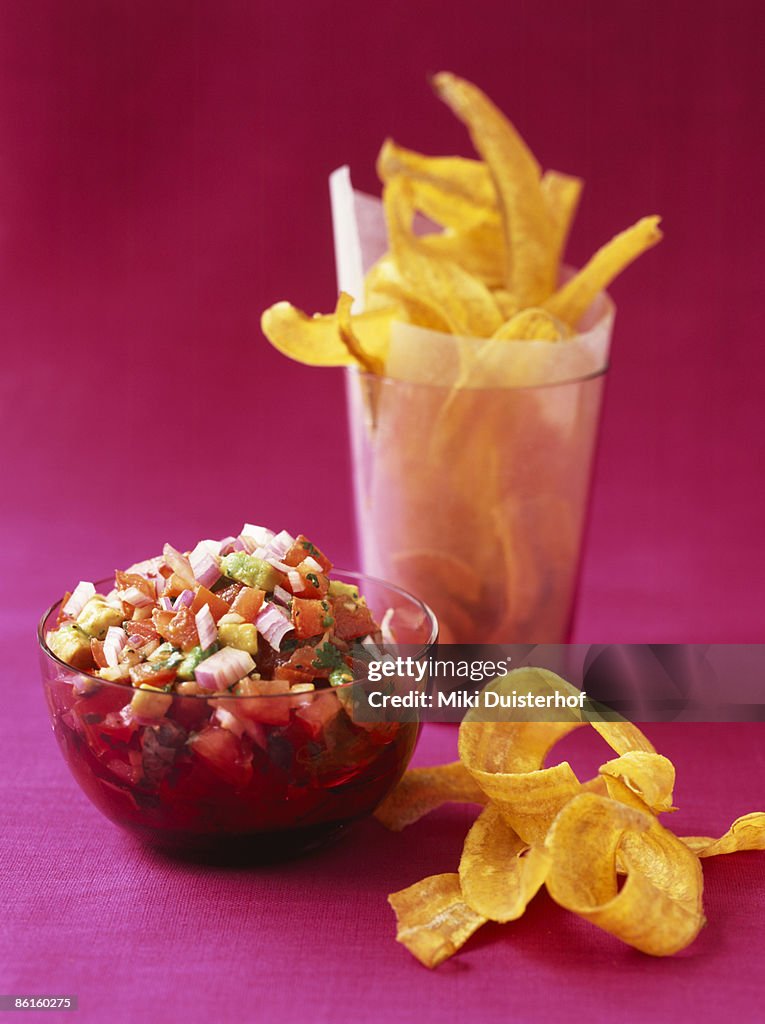 Banana chips with tomato and avocado salsa