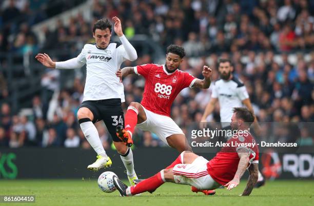 George Thorne of Derby County is tackled by Danny Fox and Liam Bridcutt of Nottingham Forest during the Sky Bet Championship match between Derby...