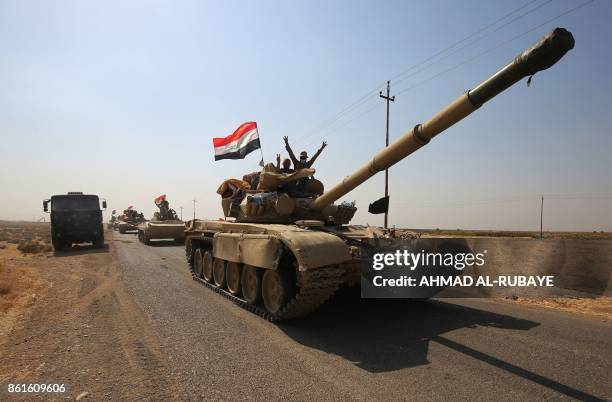 Iraqi forces drive towards Kurdish peshmerga positions on October 15 on the southern outskirts of Kirkuk. The presidents of Iraq and Iraqi Kurdistan...