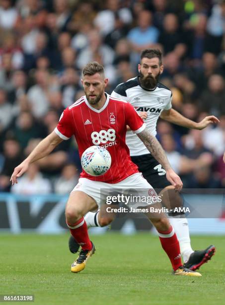 Daryl Murphy of Nottingham Forest and Joe Ledley of Derby County during the Sky Bet Championship match between Derby County and Nottingham Forest at...