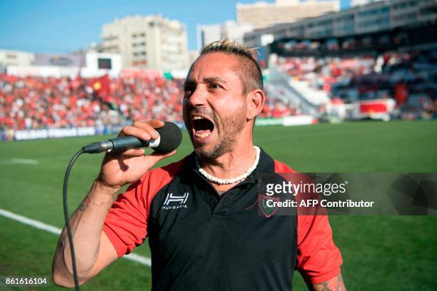 French tattoo maker and singer Cedric Abellon performs the traditional song of the RCT fans "Pilou Pilou" prior to the Champions Cup rugby union...