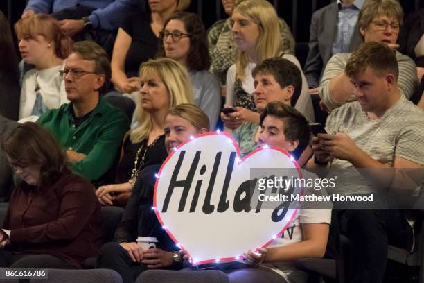 Member of the audience holds a sign in support of Hillary Clinton ahead of an interview by Mariella Frostrup at the Cheltenham Literature Festival on...