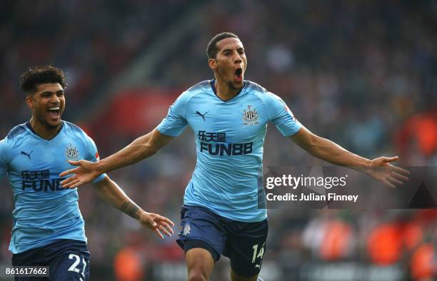 Isaac Hayden of Newcastle United celebrates as he scores their first goal with team mate Deandre Yedlin during the Premier League match between...