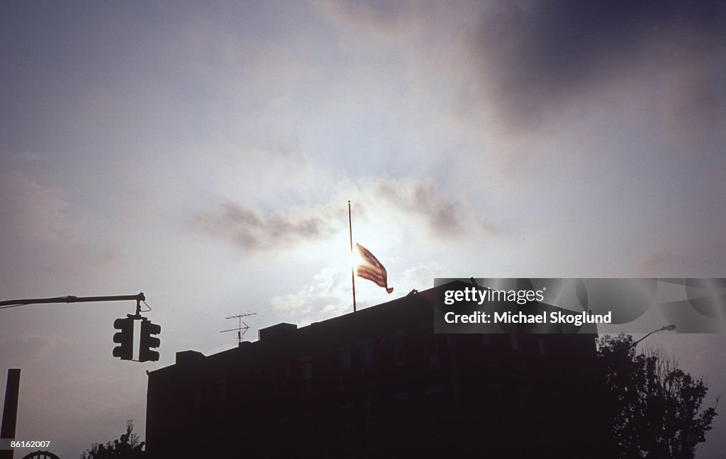 Silhouette of a building with an American flag