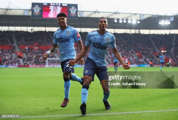 Isaac Hayden of Newcastle United celebrates as he scores their first goal with team mate Deandre Yedlin during the Premier League match between...