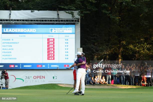 Tyrrell Hatton of England celebrates victory with his caddie during the final round of the 2017 Italian Open at Golf Club Milano - Parco Reale di...