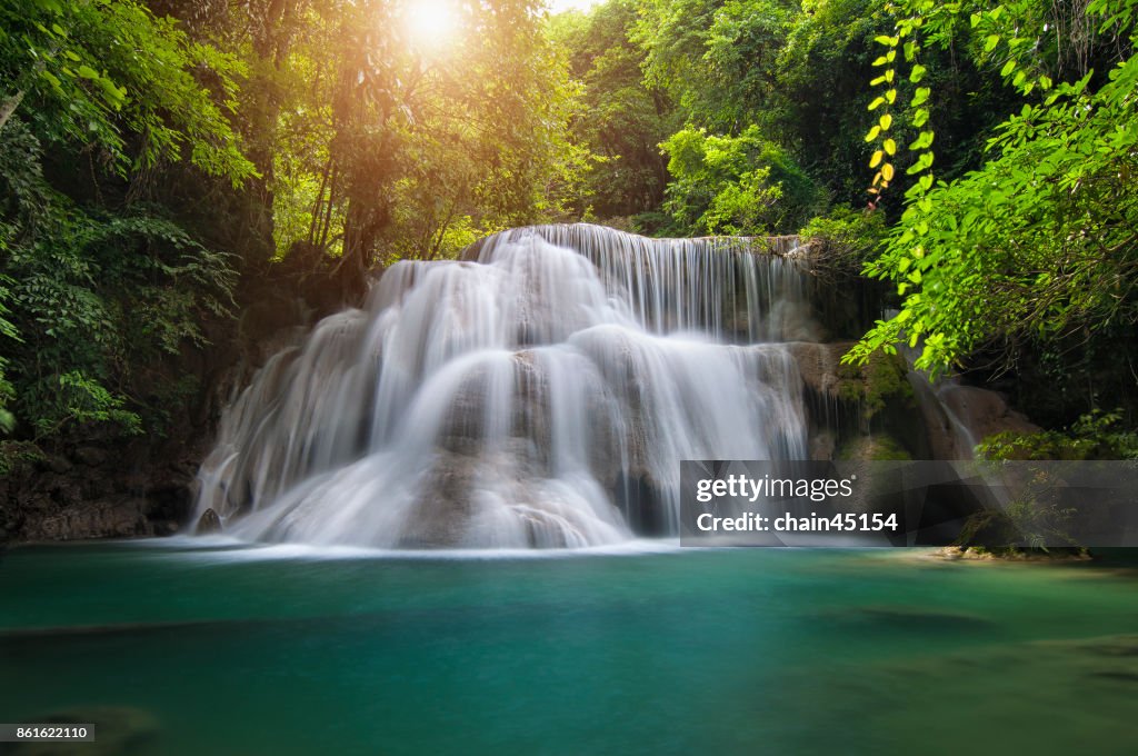Waterfall with deep forrest waterfall in Erawan waterfall National Park Kanjanaburi Thailand.