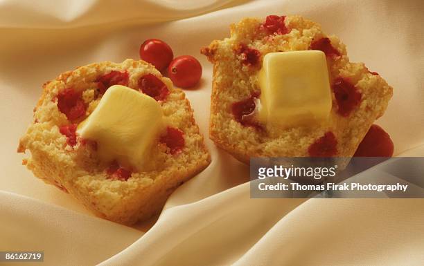 cranberry muffin with melting butter -  firak stock pictures, royalty-free photos & images