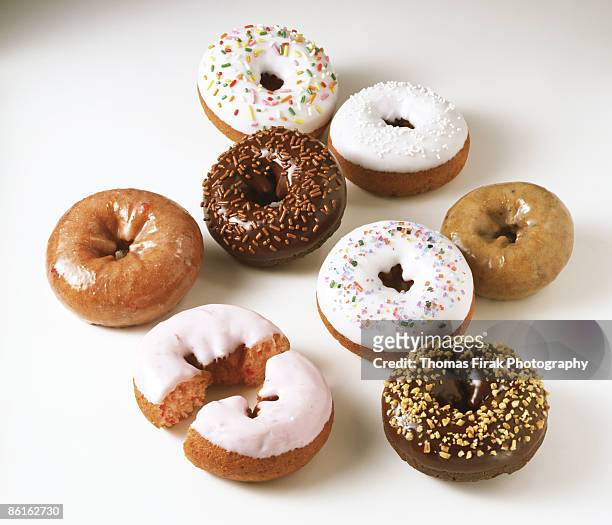 assorted doughnuts on white - chocoladedonut stockfoto's en -beelden