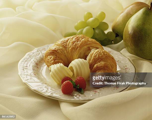 croissant with butter and fruit -  firak stock pictures, royalty-free photos & images