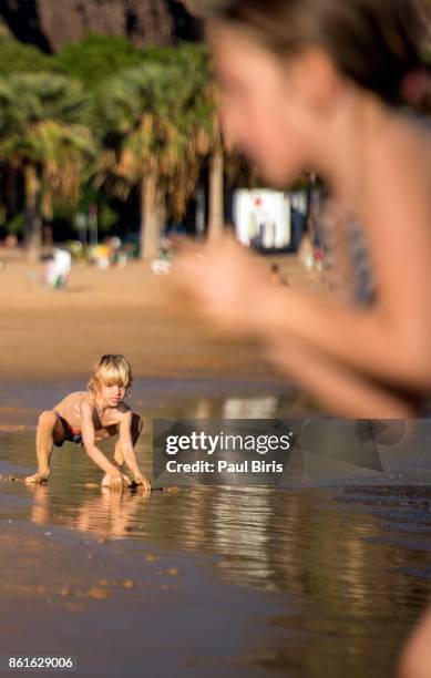 spain, canary islands, tenerife, san andres, young boy playing on  playa de las teresitas - playa de las teresitas stock pictures, royalty-free photos & images