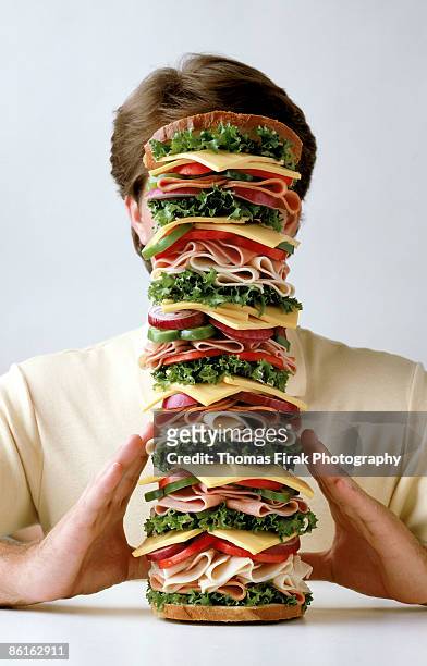 man with sandwich -  firak stock pictures, royalty-free photos & images