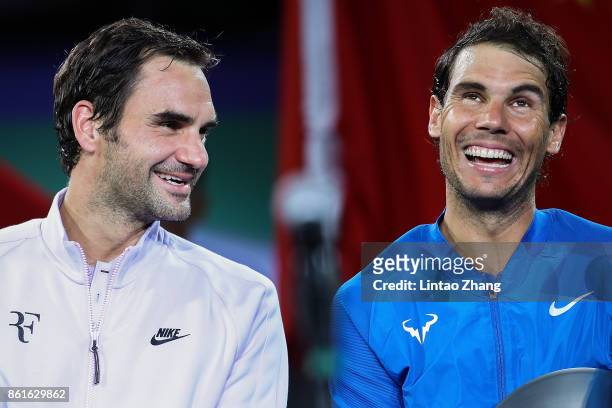 Roger Federer of Switzerland talk with Rafael Nadal of Spain during the award ceremony after the Men's singles final mach on day eight of 2017 ATP...