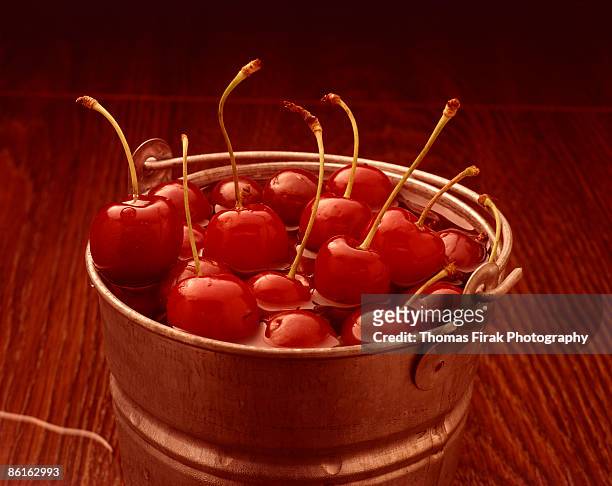 cherries in bucket -  firak stock pictures, royalty-free photos & images