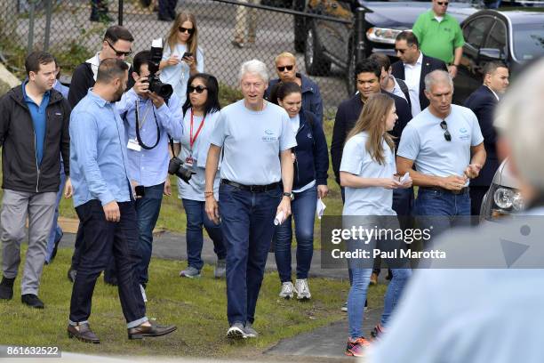Former president Bill Clinton arrives to speak with students at Clinton Global Initiative University Day Of Action as more than 600 young people...