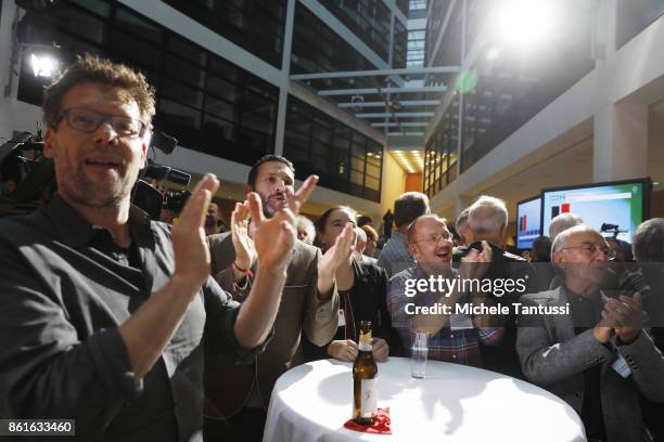 Supporters of the German Social Democrats , react following initial election results that give the party 37% in state elections in Lower Saxony at...