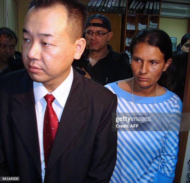 Digna Leguizamon and her lawyer Seong Je Park leaves the court after the presentation of a plaint against Paraguayan President Fernando Lugo, in...