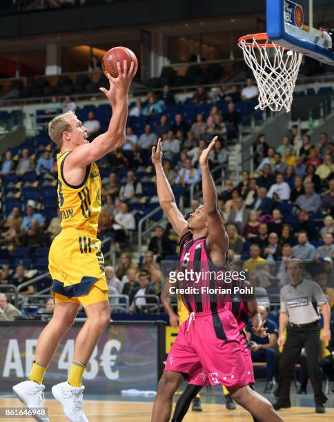 Luke Sikma of Alba Berlin and Malcolm Hill of Telekom Baskets Bonn during the game between Alba Berlin and the Telekom Baskets Bonn at Mercedes-Benz...
