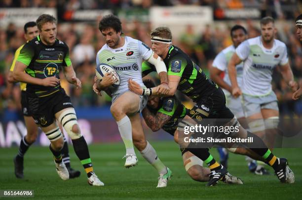 Marcelo Bosch of Saracens tries to break through the Northampton Saints defence during the European Rugby Champions Cup match between Northampton...